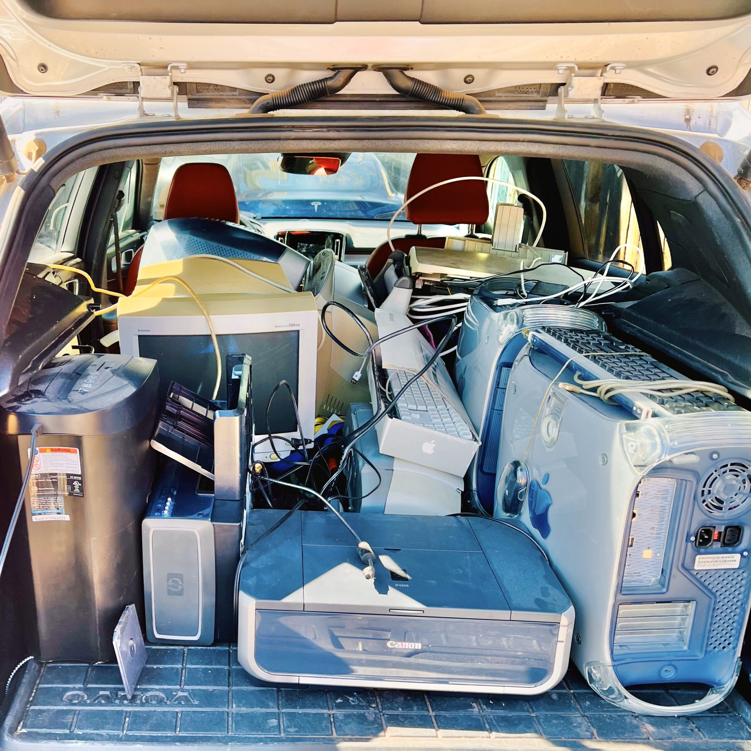 Electronics to recycle loaded up into the back of a car to take to a Colorado Springs recycling center